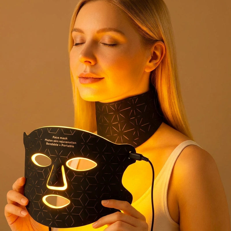 Woman wearing a neck mask with a glowing face mask held in front of her.